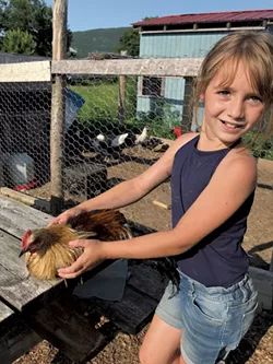 Natalie with Coco the chicken - BRETT ANN STANCIU