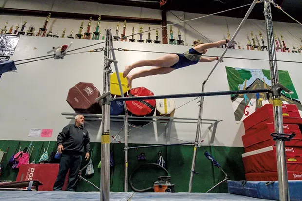 Hruska coaching Bridget Haggerty on the uneven bars - GLENN RUSSELL