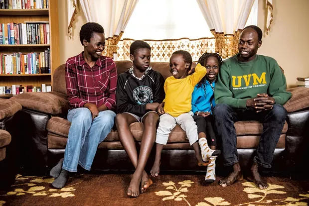 Akol Aguek (right), an international student advisor at the University of Vermont, and Martha Machar (left), deputy finance officer for the city of South Burlington, with kids Deng, 13, Ngong, 4, and Adut, 6 - SAM SIMON