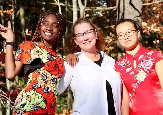 Teacher of the year Susan Rosato with students Steldie Mabiala (left) and Peas Liu - COURTESY OF MEGAN MCLOUGHLIN