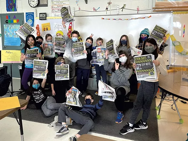 The Malikians, Burlington, holding copies of Seven Days and Kids VT. - COURTESY