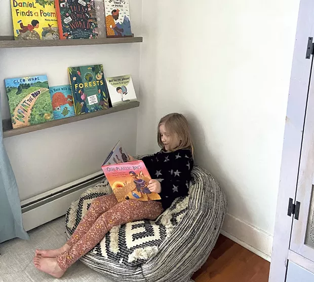 Meredith's daughter reading One Plastic Bag - MEREDITH BAY-TYACK