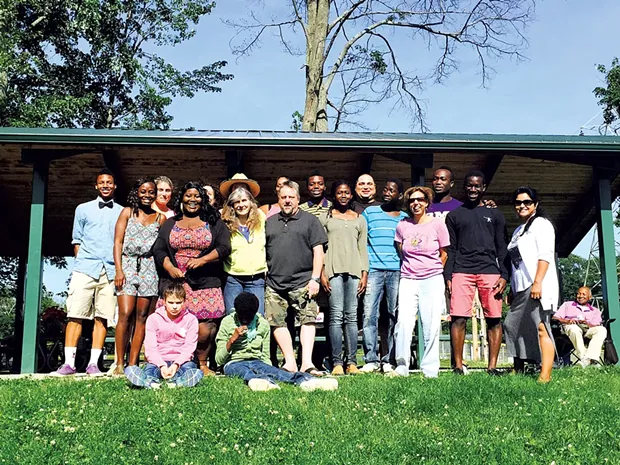 Theresa Tomasi with 18 of her children - COURTESY OF TAI TOMASI