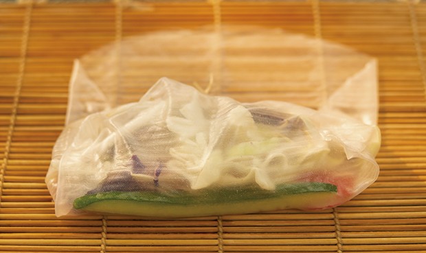 Folding the vegetable spring roll - ANDY BRUMBAUGH