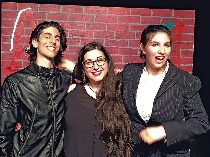 Sofie (center) with theater company members