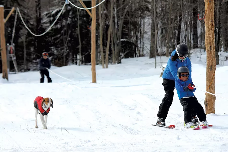 Family members ride the rope tow - TRISTAN VON DUNTZ