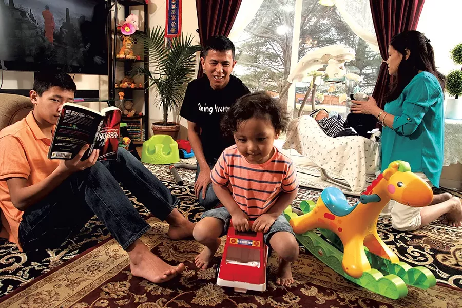 Dad: Hemant Tamang-Ghising, 42 - Mom: Surja Tamang, 40 - Kids: Sons Hessain, 14, Hwang, 3, and Hrimsang, 8 weeks - MATTHEW THORSEN