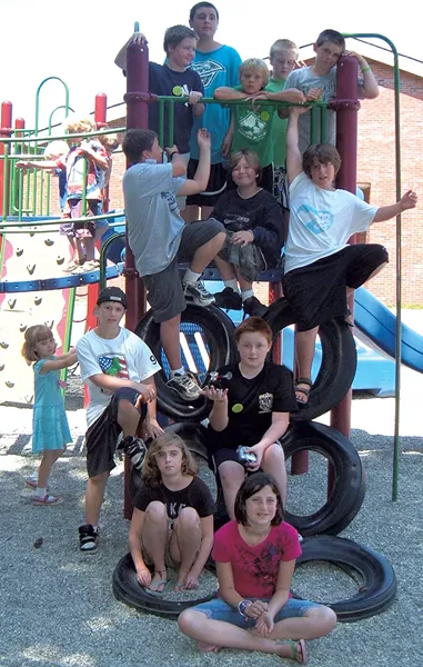 Campers pose on a play structure - COURTESY OF OCCC