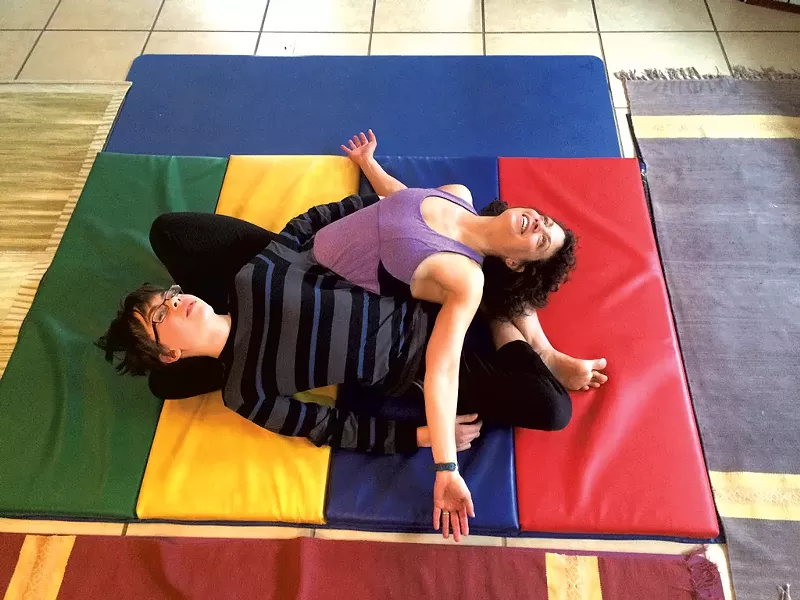 Janet and Adam practice the yin-yang stretch - COURTESY OF JANET FRANZ