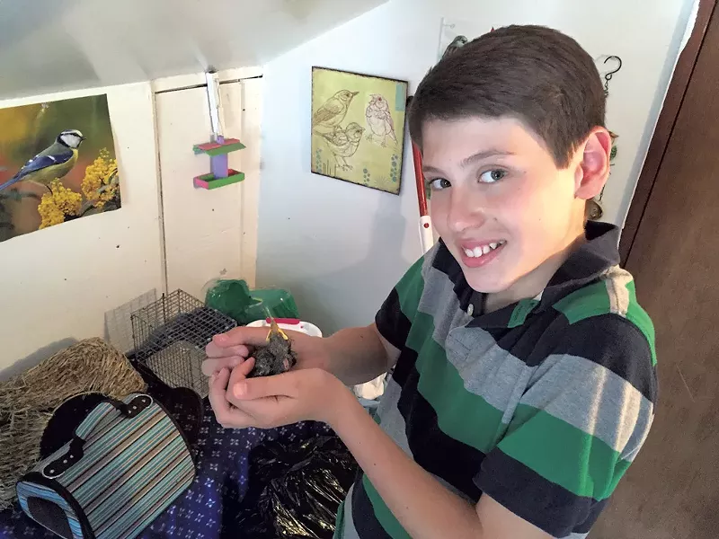 Edward with a baby bird - COURTESY OF JENNY JOCZIK