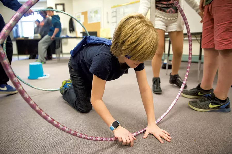George Francisco navigating an obstacle course while blindfolded at Williston Central School - JAMES BUCK