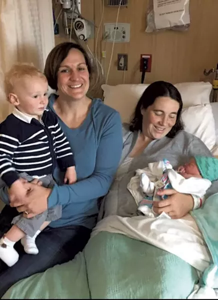 Julie Sloan (right), holding baby Owen, with her wife, Amy Welch, and son Lucas - COURTESY OF JULIE SLOAN