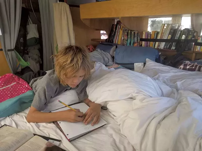 Nahum does schoolwork - COURTESY OF GRACE AHMED
