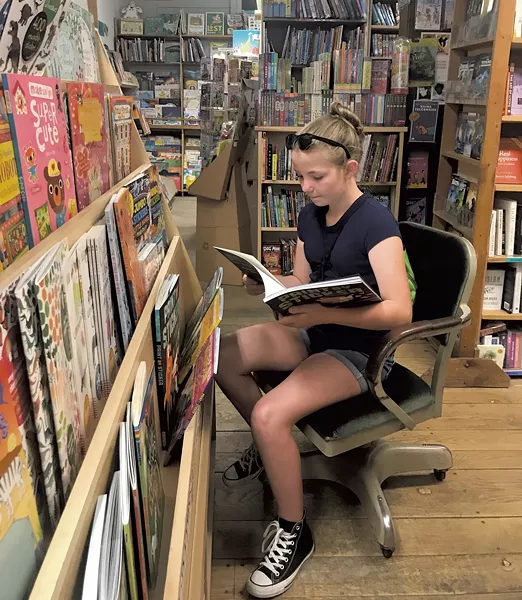 Maverick browses at Everyone's Book - BRETT STANCIU