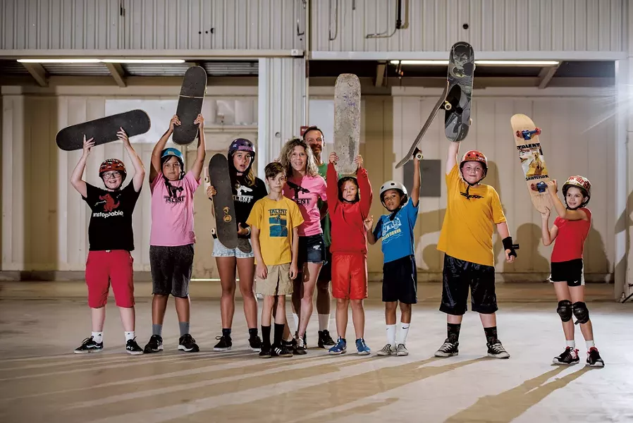 Hannah Deene Wood and David Wood with skateboarders (from left to right) Kyle Buck, Jasper Cleary, Juni Cleary, Henry Meunier, Arthur Lea, Creston Lea-Simons, Liam Kelley and Evelyn Santillo at Talent's new Burlington location - SAM SIMON