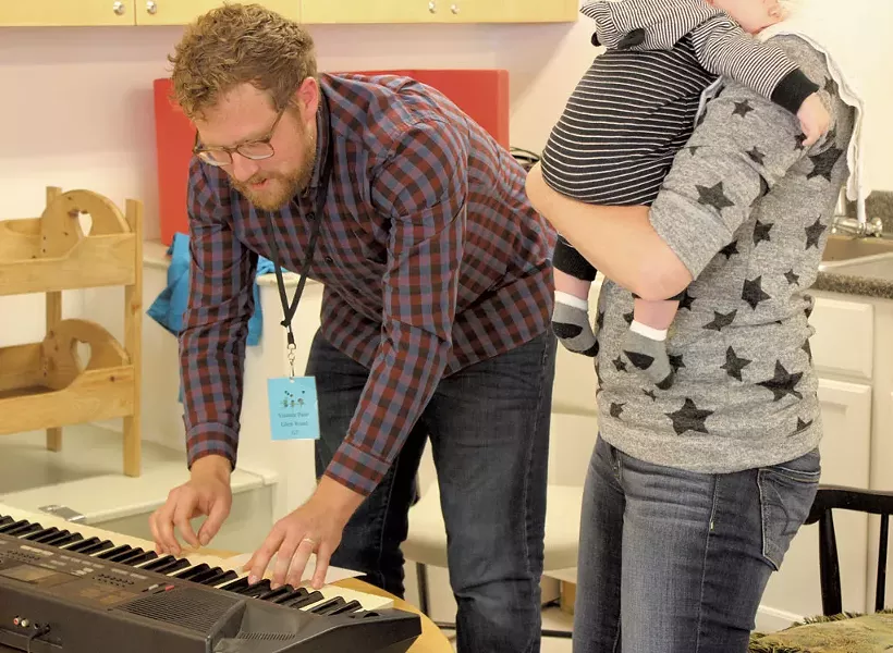 Evan Premo helps a mother compose a lullaby - COURTESY OF LUND