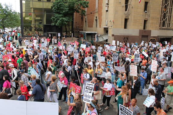 More than 1,000 people demonstrated in the streets of downtown Detroit against the city's ongoing water shutoffs on July 18, 2014. The protest was organized by the National Nurses United. - RYAN FELTON/METRO TIMES