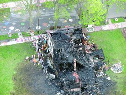 The charred hulk of the “Obstruction of Justice House” at Detroit’s Heidelberg Project.