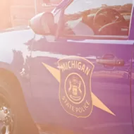 Michigan trooper charged after siccing K-9 on suspect for minutes after he surrendered