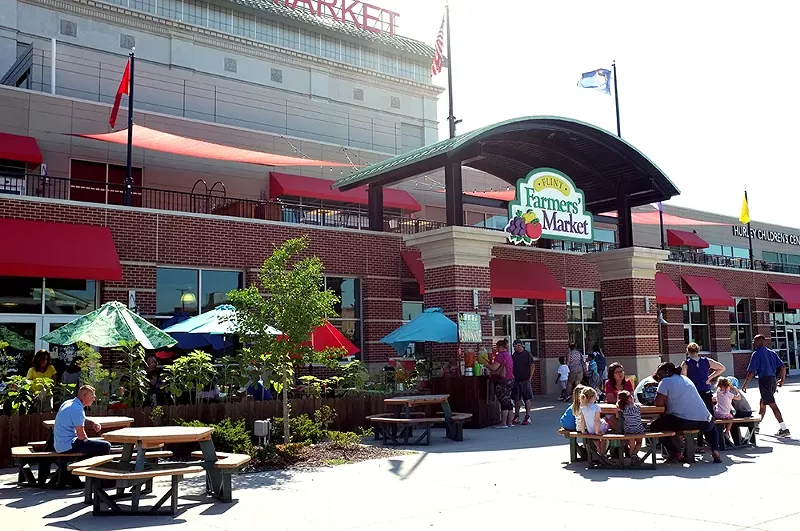 Shoppers and diners mill about at the Flint Farmers' Market. - SCOTT ATKINSON