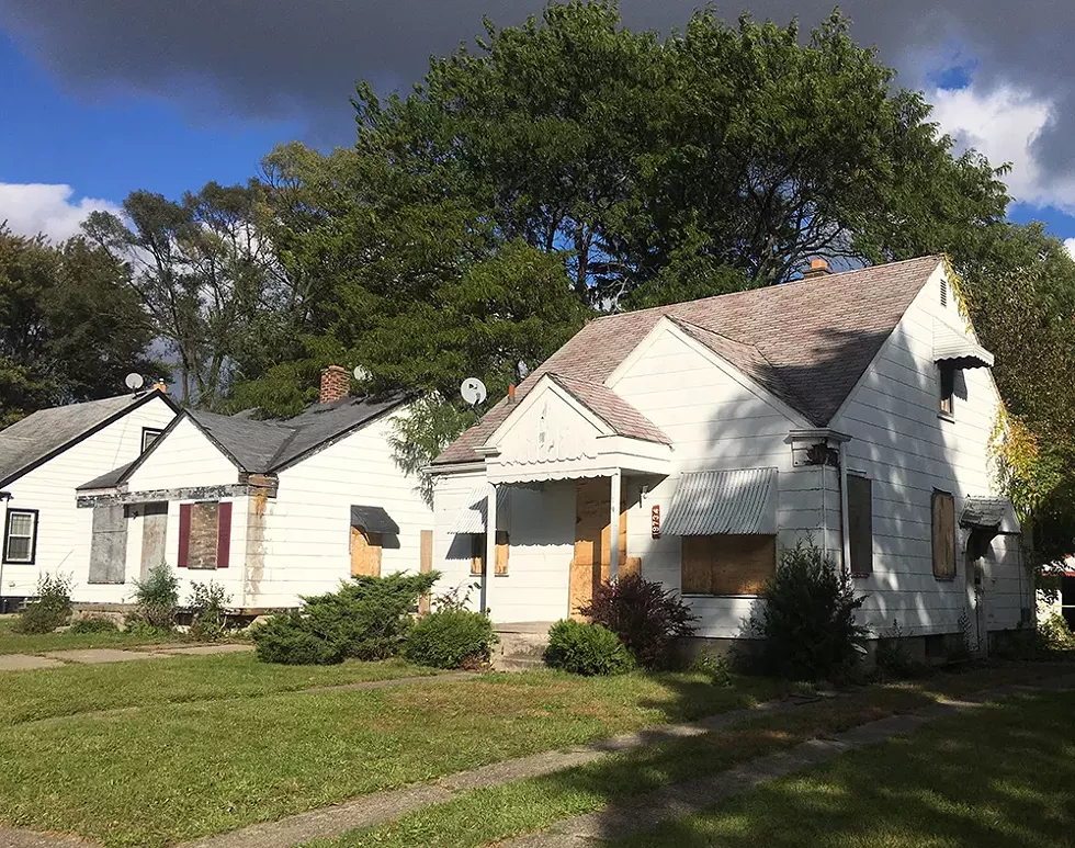 Which house is in worse shape? According to the Land Bank, the one on the right, with a hole in its side, is “unlikely to be blighted.” The one on the left is “likely to be blighted.” - VIOLET IKONOMOVA