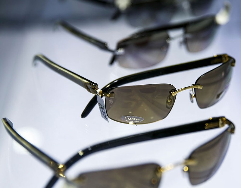 Cartier sunglasses on display at Optica at Somerset Collection. - SEAN PROCTOR
