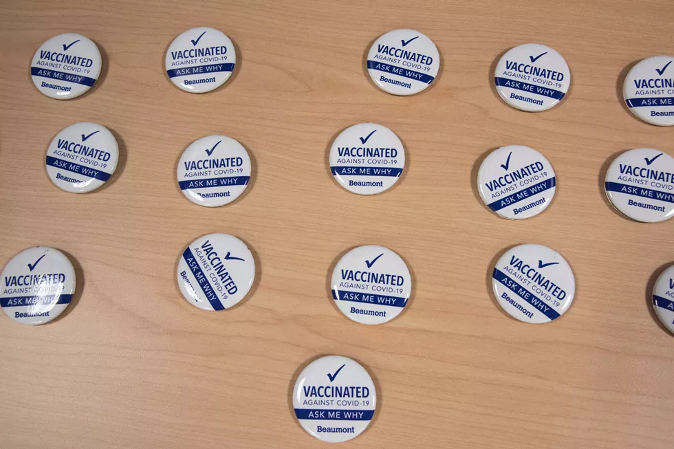 To increase confidence in the vaccines, Beaumont employees who receive shots are asked to wear a button that reads, "Vaccinated Against COVID-19. Ask me why." - COURTESY OF BEAUMONT