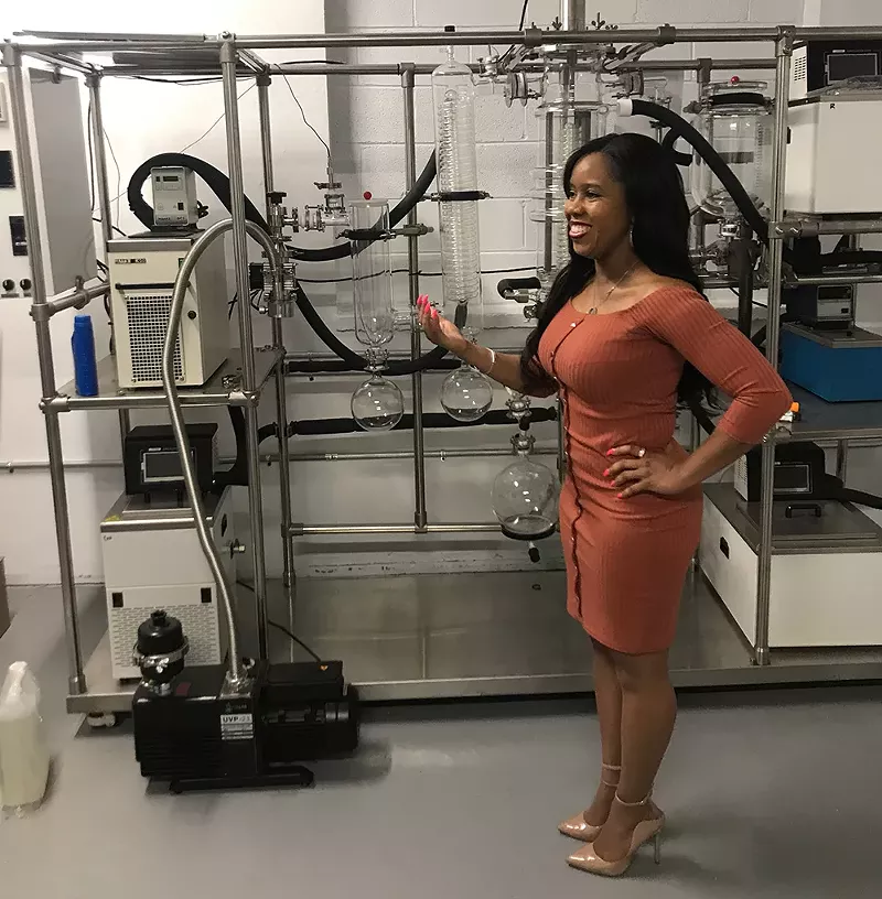 Vetra Stephens of cannabis company 1st Quality Medz shows her extraction machine. - LARRY GABRIEL