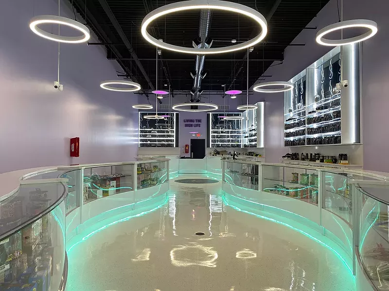 Leaf and Bud's long Detroit showroom is flanked by two curvy, neon-accented countertops. - COURTESY OF LEAF AND BUD