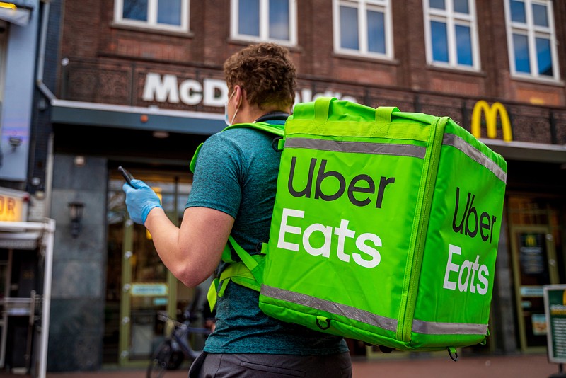 An Uber Eats food delivery man. - RIKU MANNISTO / SHUTTERSTOCK.COM
