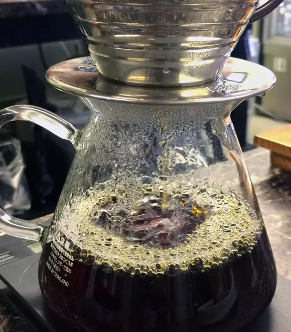 Pourin' over. - PHOTO BY TOM PERKINS