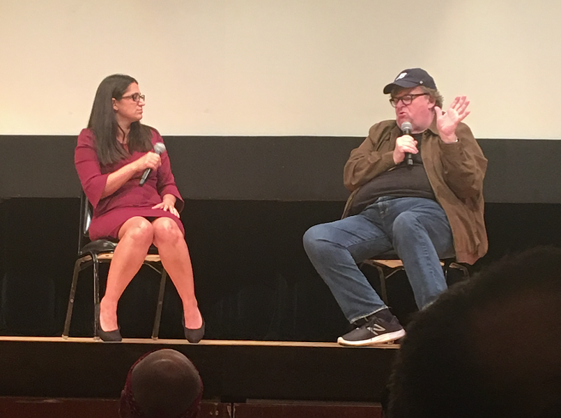 Dr. Mona Hanna-Attisha and Michael Moore speak at the premiere of Fahrenheit 11/9 in Flint. - COREY HALL