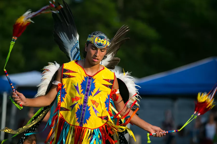 A young male fancy dancer at the Little River Band of Ottawa Indians annual Pow wow, in full regalia. - DARLENE STANLEY / SHUTTERSTOCK.COM