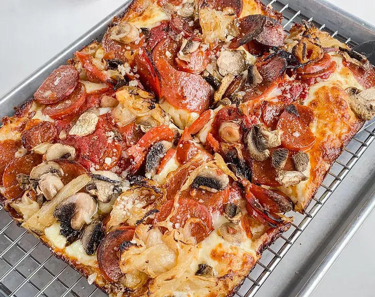 “The Granny” from Como's, with pepperoni, mushrooms, and caramelized onions. - TOM PERKINS
