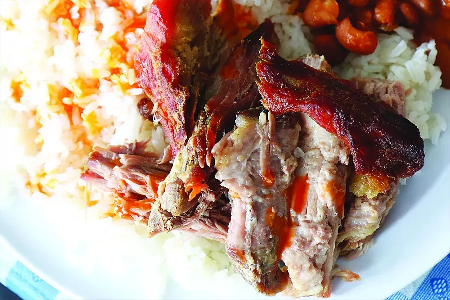 PERNIL, ROASTED PORK SHOULDER WITH WHITE RICE AND WHOLE BEANS. | PHOTO/SCOTT SPELLMAN