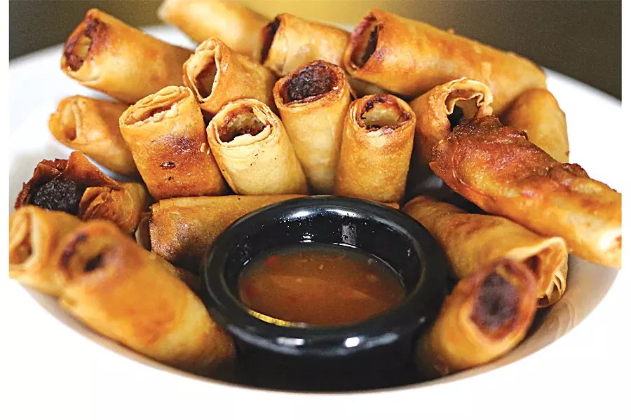 Taste of Manila serves these lumpia, which combine meat, deep-frying, and a tangy dipping sauce into a dish that seems almost tailored to American tastes. - PHOTO BY SARAH RAHAL.
