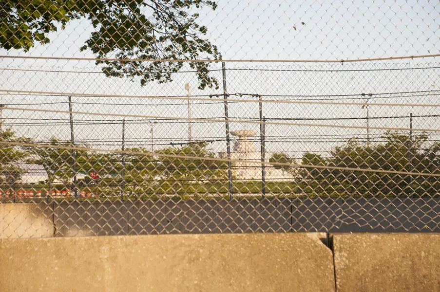 Four rows of fencing and barricades separates the Scott Fountain and Sunset Drive. Critics say the island looks like Alcatraz. - TOM PERKINS