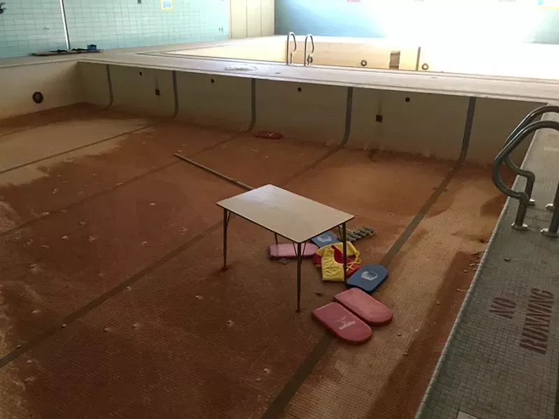 In this photo from the lawsuit, any water in the disused pools at Osborn High School is there only by accident. - PHOTO COURTESY PUBLIC COUNSEL