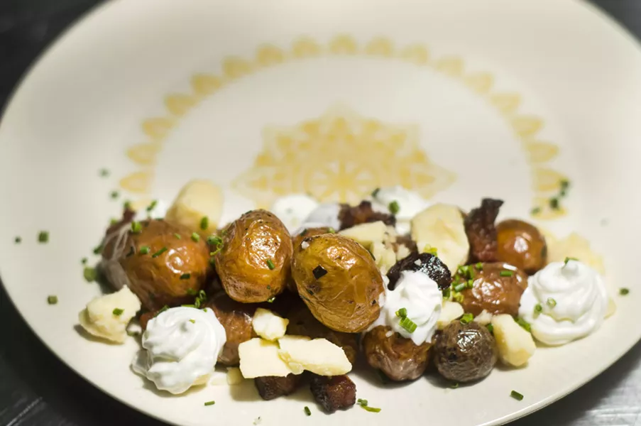 Potato with smoked new potato, black olives, hard boiled eggs, feta, arugula, preserved lemon sauce - TOM PERKINS