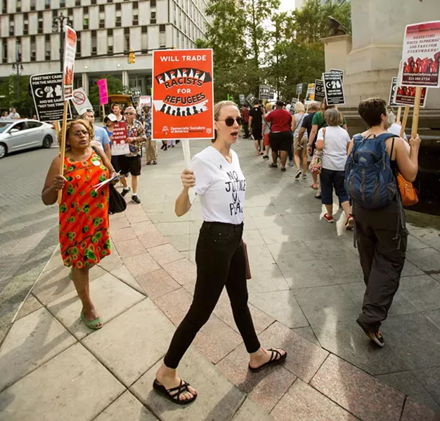 DSA steering committee member Naomi Burton marches in an anti-fascist rally in Detroit following last summer's car attack in Charlottesville, Va. - NICK HAYES