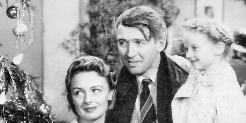 Jimmy Stewart, Donna Reed, and Karolyn Grimes in It's a Wonderful Life.