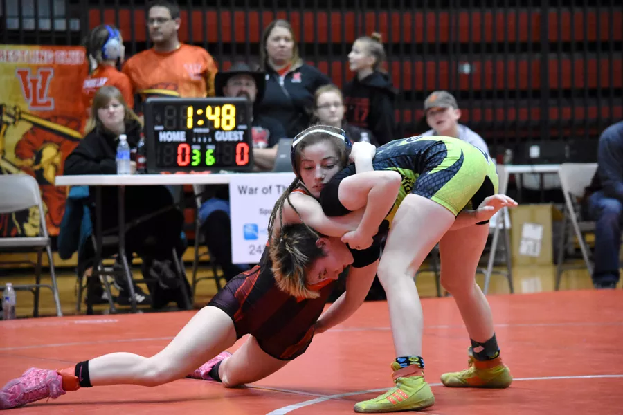 Katlyn Pizzo (left) sprawls during a match, fighting for control. - RACHEL TIMLIN