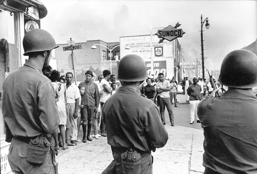 National Guardsmen patrol Detroit during the summer of 1967. - THE TONY SPINA COLLECTION, WALTER P. REUTHER LIBRARY, ARCHIVES OF LABOR AND URBAN AFFAIRS, WAYNE STATE UNIVERSITY