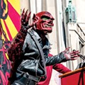 The "Red Dwarf" speaks at the Marche du Nain Rouge, 2015.