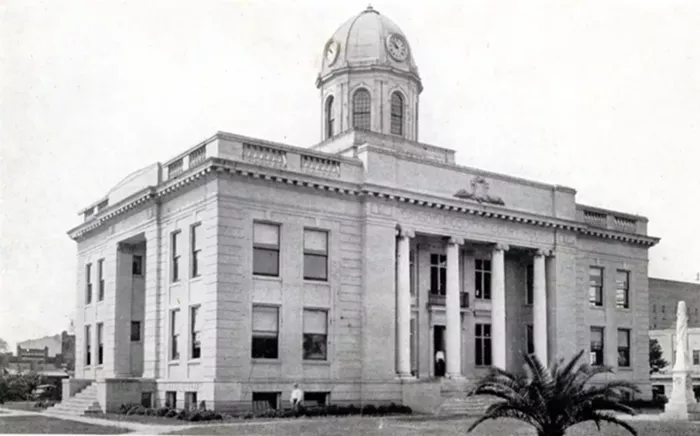 Erected in 1884 by the Ladies of the Memorial Association of Gadsden County, a Confederate monument in Quincy featured a phalanx atop a four-sided base. On one side of the base appears to be an officer in a dress uniform. On another side it said, "Sacred to the memory of the Confederate Soldiers from Gadsden County who died for their country." - PHOTO BY CHICAGO COMMERCIAL COLORTYPE COMPANY/STATE ARCHIVES OF FLORIDA