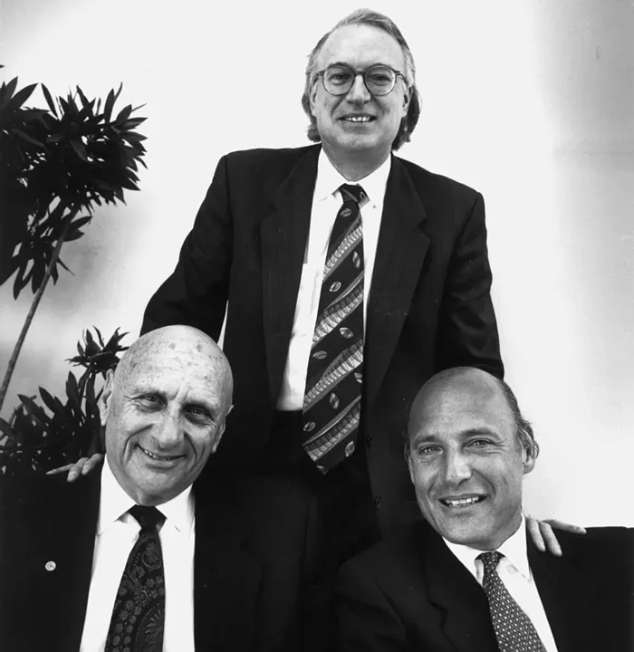 Roy Black (standing), Albert Krieger, and Martin Weinberg, three members of Falcon and Magluta's defense team. - NEW TIMES PHOTO BY STEVE SATTERWHITE