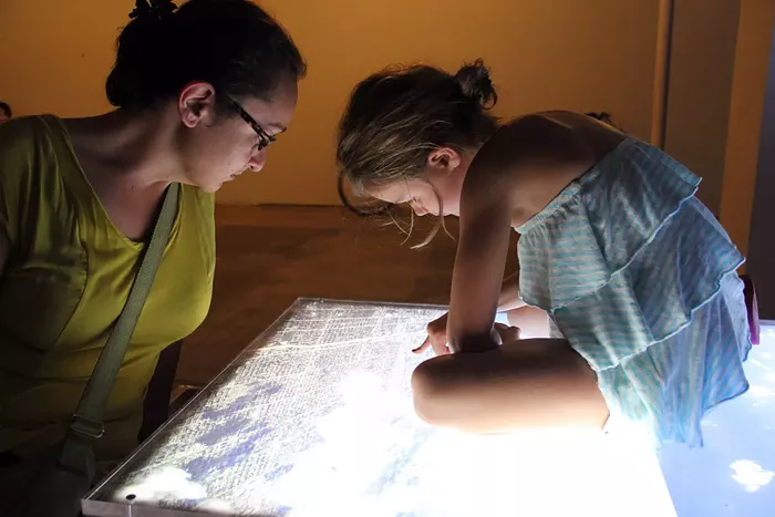 Sandra Ramos (left) with an unidentified art connoisseur at Illuminate Coral Gables in February 2021. - PHOTO BY SANDRA RAMOS COURTESY OF ILLUMINATE CORAL GABLES