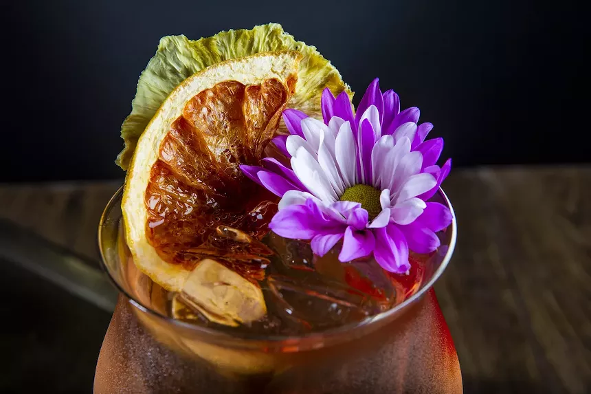 The flower-topped "1 Wish" is among the cocktail offerings at No Man's Land. - PHOTO BY SHELBY COOPER