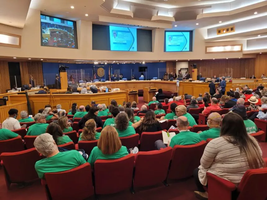 Residents opposed to the development attended Wednesday's zoning hearing in a sea of matching "Save Calusa" green shirts. - PHOTO COURTESY OF AMANDA PRIETO