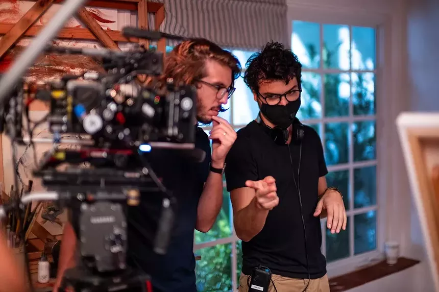 Directors Oscar Ernesto Ortega and Carlos Rafael Betancourt on the set of Borrowed in Miami Beach’s Normandy Isles neighborhood. - PHOTO COURTESY OF JOSE ROVIRA